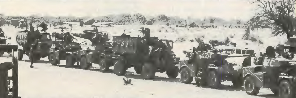 Choppers, Dakota and armored fighting vehicles stand by to move during a long-range penetration into Angola.