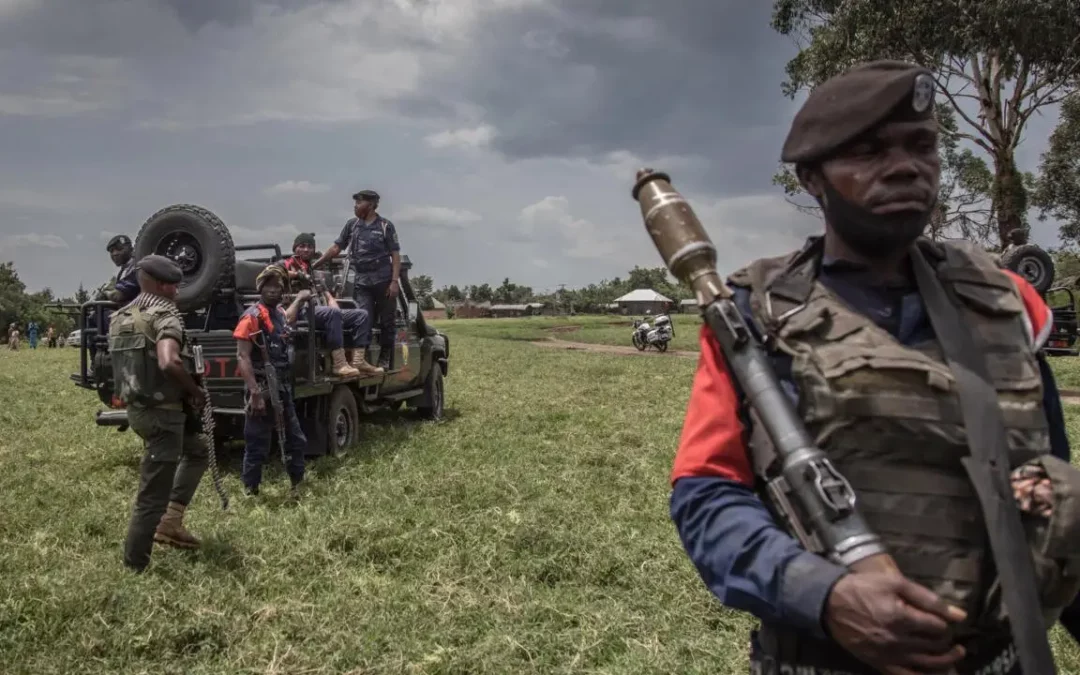 Soldiers of the Democratic Republic of Congo's armed forces perform a security patrol around the Kiwanja airfield days after clashes with the M23 rebels