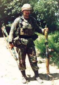 American Volunteer in the Rhodesian Army, Lieutenant Willard "Chomps" Fleetwood poses with a captured terrorist rocket launcher. He is pictured as a junior officer in "A" Coy, 1st Battalion, Rhodesian African Rifles, 1980